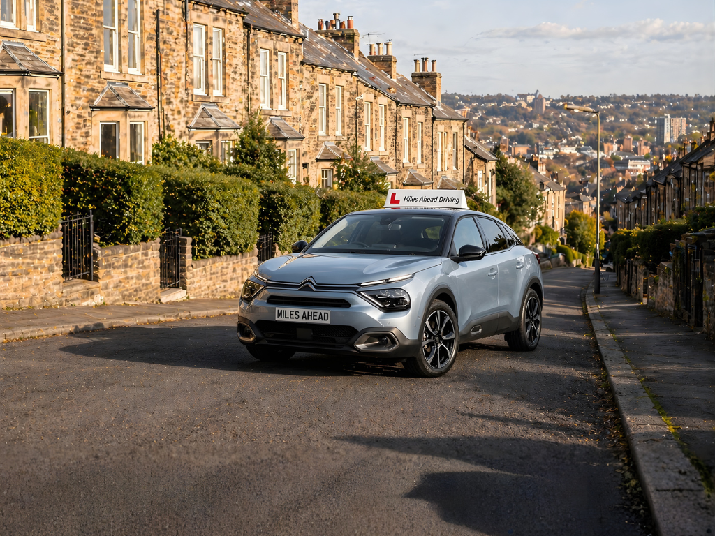 miles ahead's learner car parks on the road